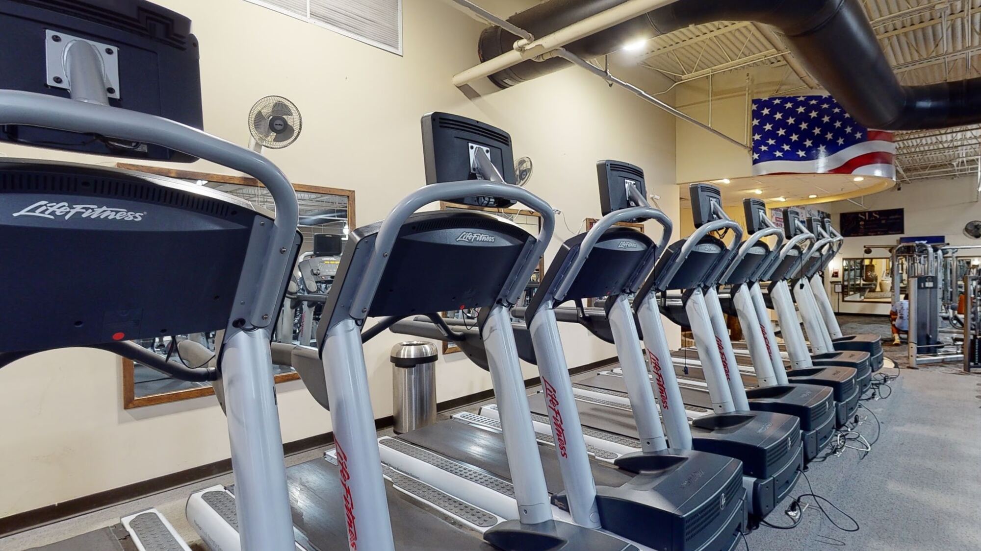 Row of treadmills on the cardio deck