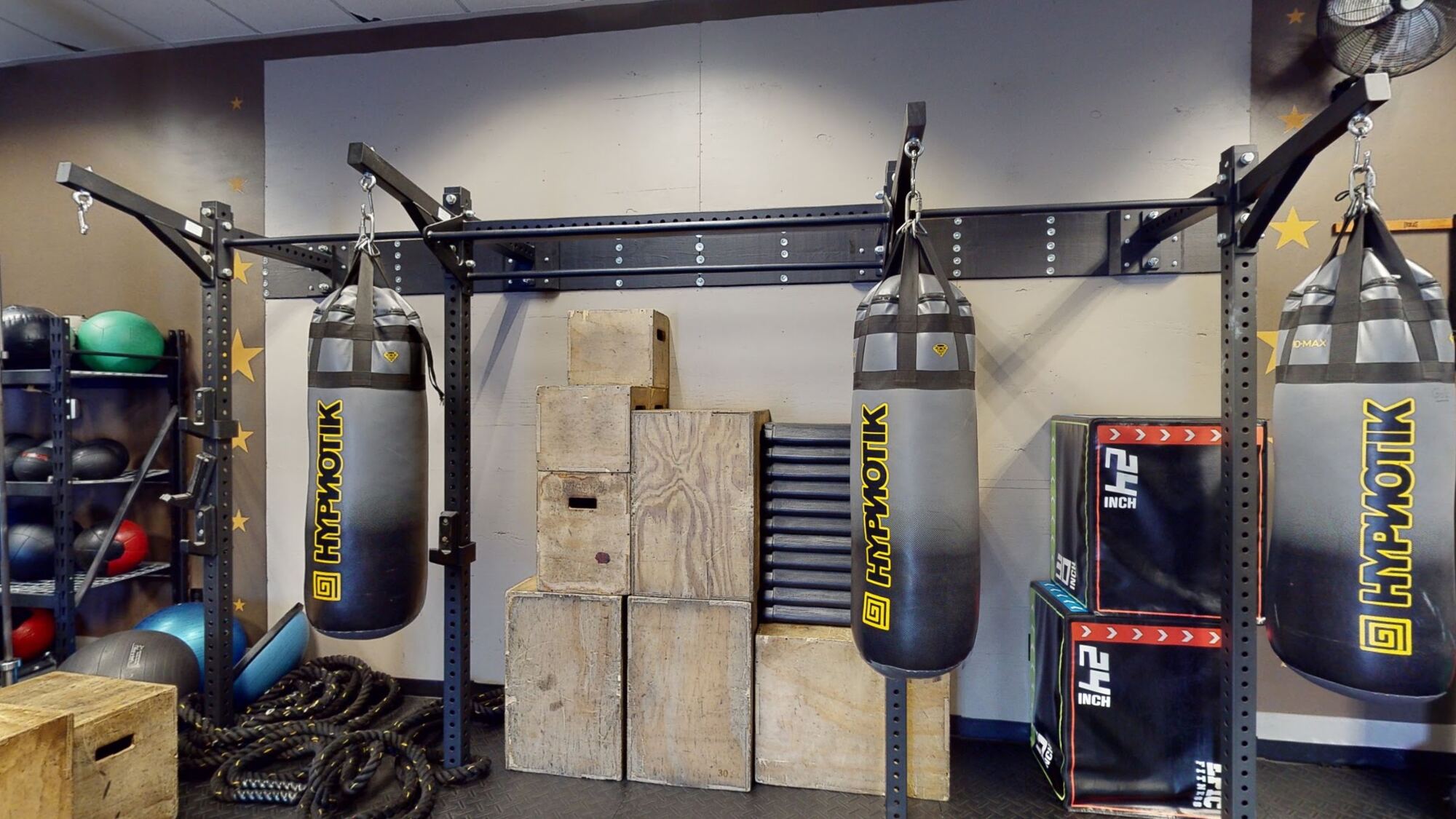 Functional fitness room with heavy bags and plyo boxes